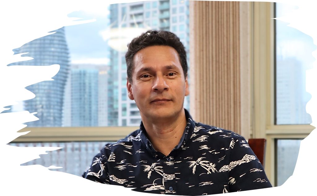Photo of Raul, an instructional designer, smiling and looking professional.